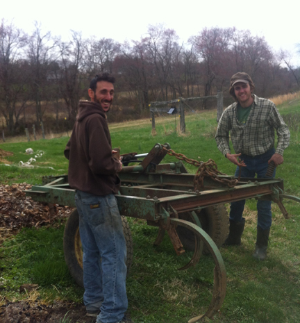 CSA manager Adam Kandel (left) and Taylor show off the new chisel plow.